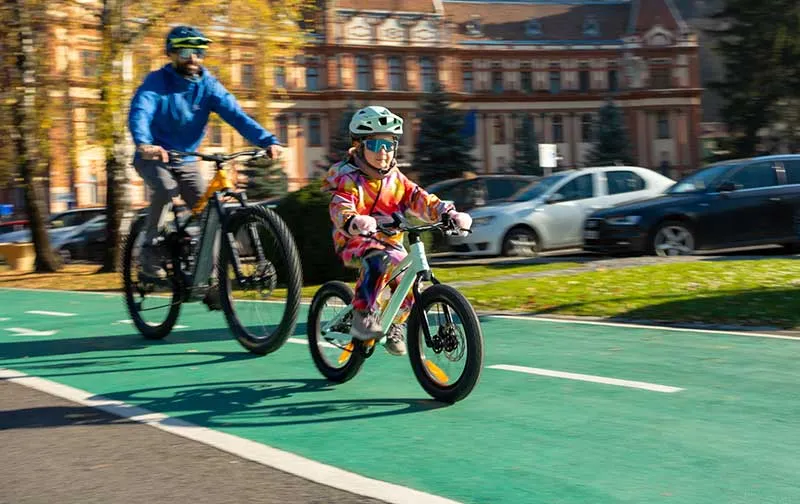 Dad and kid biking