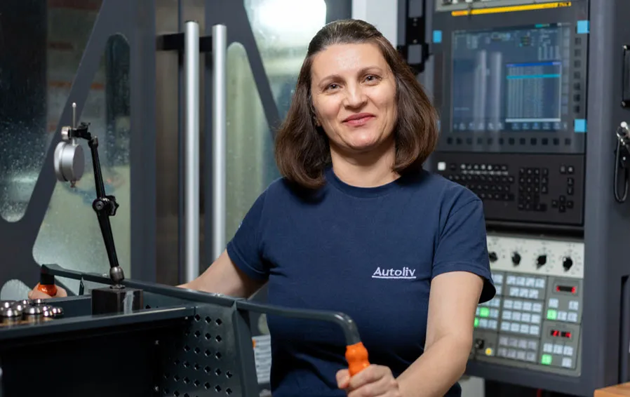 Employee working by machine